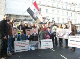 Syrians demonstrate outside the Syrian embassy in London in support of President Assad and against the armed gangs