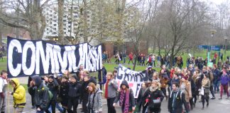 Students march through the campus their main banner displaying their hostility to capitalism and privatisation