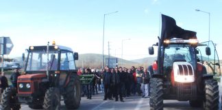 Small farmers with their tractors blockading a national road in central Greece. Photo courtesy left.gr