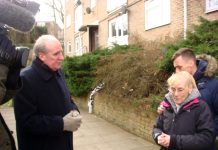 Tenant Joan Elsby and her son Kevin with Crown Properties executive Nick Wood, BBC cameras looking on.