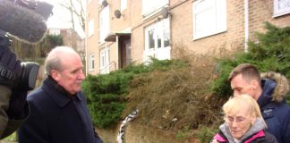 Tenant Joan Elsby and her son Kevin with Crown Properties executive Nick Wood, BBC cameras looking on.