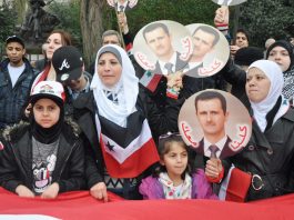 Syrian women and children supporting President Assad outside the Syrian Embassy last year