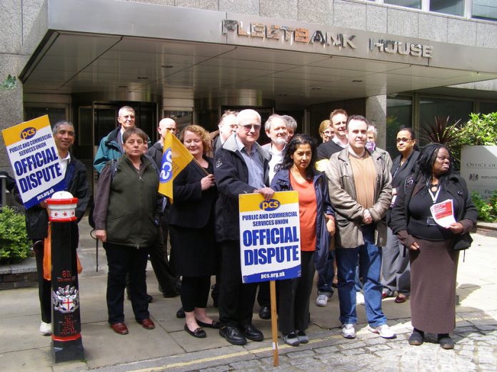 Striking PCS members on the picket line outside the Equality and Human Rights Commission in central London yesterday