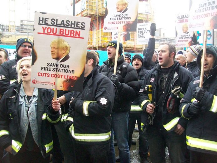 Firefighters demonstrating outside the London Fire Authority on February 11 against plans to close 12 fire stations in London