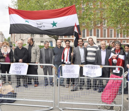 Syrians demonstrate outside the US embassy in London in support of President Assad against the imperialist support for terrorist acts in Syria