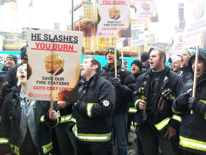 Firefighters lobby the London Fire Authority on February 11 demanding ‘No cuts’