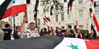 Syrian workers and youth picket the Saudi embassy in London in support of President Assad