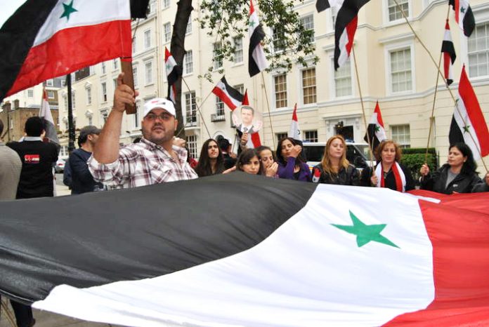 Syrian workers and youth picket the Saudi embassy in London in support of President Assad