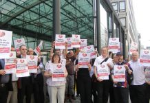 Post Office workers rally yesterday afternoon in Westminster while striking to keep Crown Post Offices open