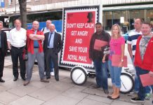 West Midlands delegation standing by a CWU campaign banner outside the CWU Policy Forum in central London showing their determination to stop privatisation