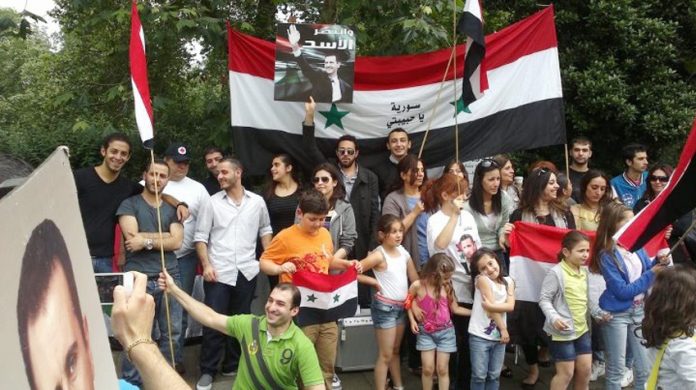 Syrians in London demonstrating in support of President Assad – Hezbollah is ready to send its fighters to defeat the imperialist-backed terrorists