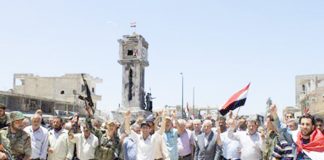 Syrian troops celebrate the liberation of Al-Qusayr near the border with Lebanon