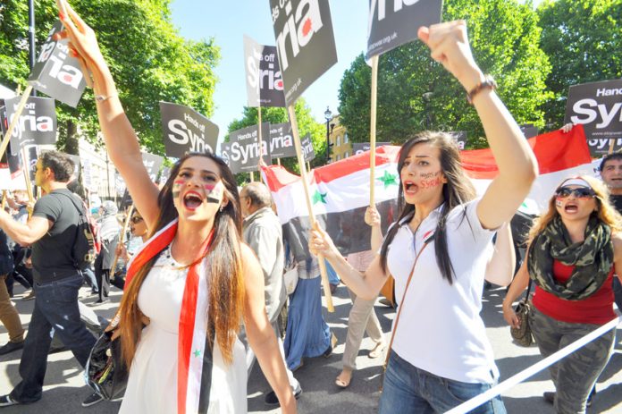 Young girls marching past Downing Street chanted ‘Hands off Syria’
