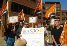 Labour MP TOM WATSON (holding poster on left) joins the GMB demonstration outside McDonald’s headquarters in Finchley yesterday morning