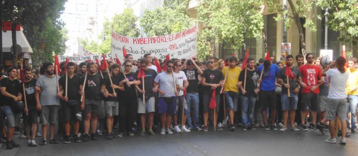 University students  marching in Greece – the banner reads ‘Overthrow the government’