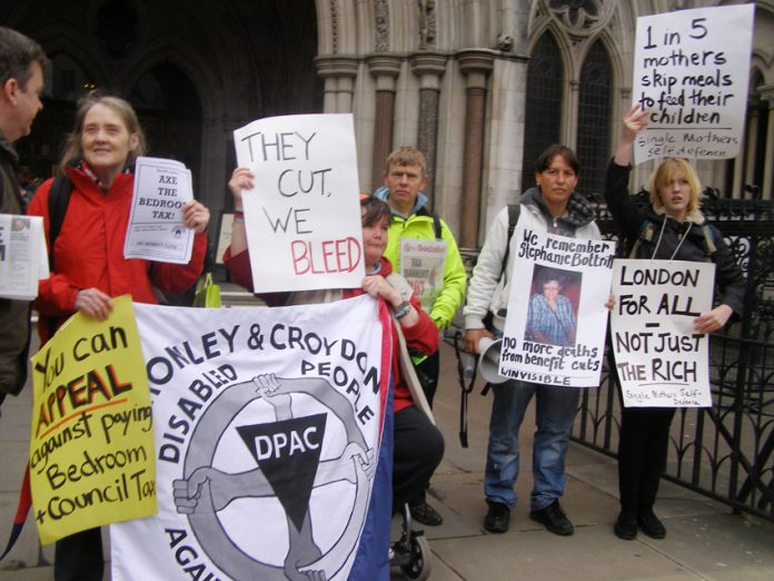 Protest against benefit cuts outside the High Court in London earlier this year