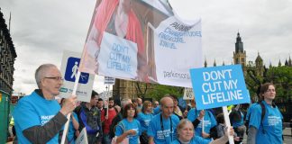 A march in London against cuts to benefits and services for disabled people being carried out by the coalition government