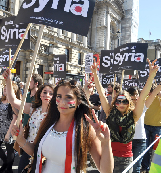 Syrian girls marching in London demanding no foreign intervention against Syria