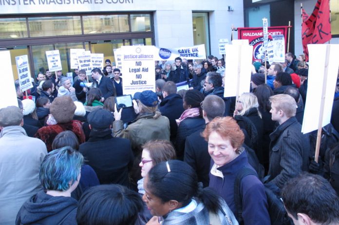 The over 200-strong demonstration against Legal Aid cuts outside Westminster Magistrates Court in London yesterday morning