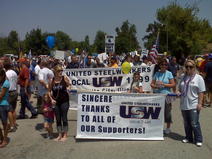 USW workers from Illinois thank supporters at a rally during their fight to defend jobs against their employer