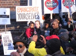 ‘Police are the murderers! No Justice No Peace!’ – chants 2,000-strong mass vigil CAROL DUGGAN, Mark’s aunt, addresses the crowd