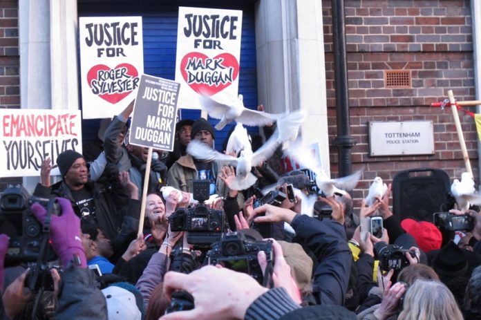 The Duggan family release doves at the end of the vigil outside Tottenham police station to emphasise the peaceful, but very determined nature of their protest