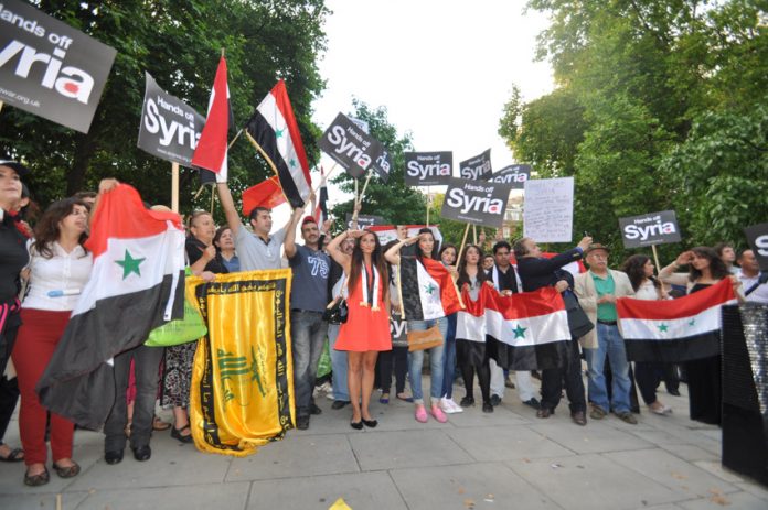 Syrians in London defend their country and picket the US embassy