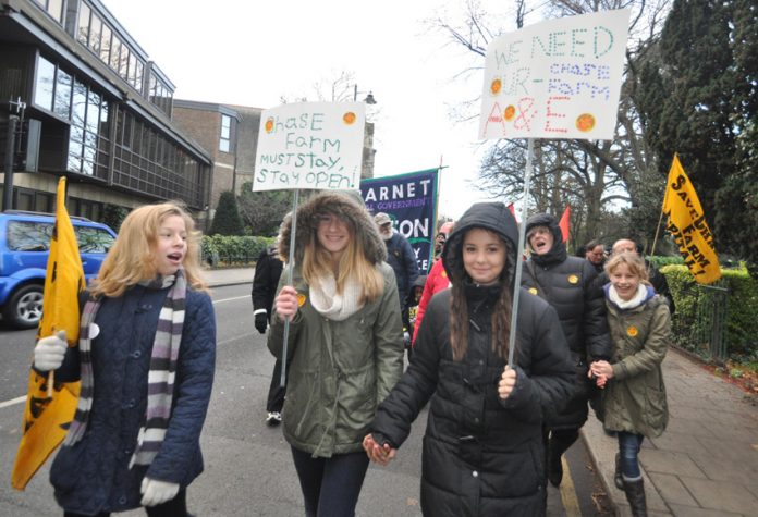 Youth join the march through Enfield Town on the day before the A&E at Chase Farm Hospital was closed last December