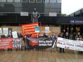 Trade unionists rally outside Euston Station demanding rail re-nationalisation – twenty years after it was privatised in 1993