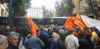 Greek riot police squads and buses block the road to demonstrating teachers last Thursday