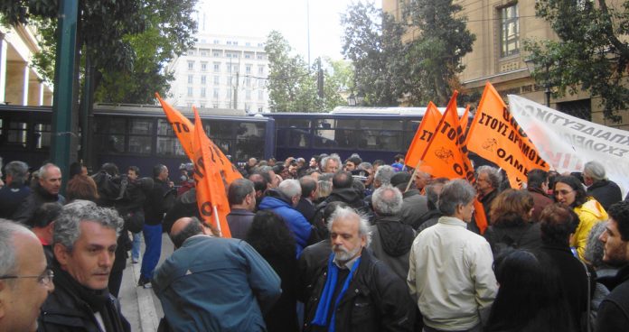 Greek riot police squads and buses block the road to demonstrating teachers last Thursday