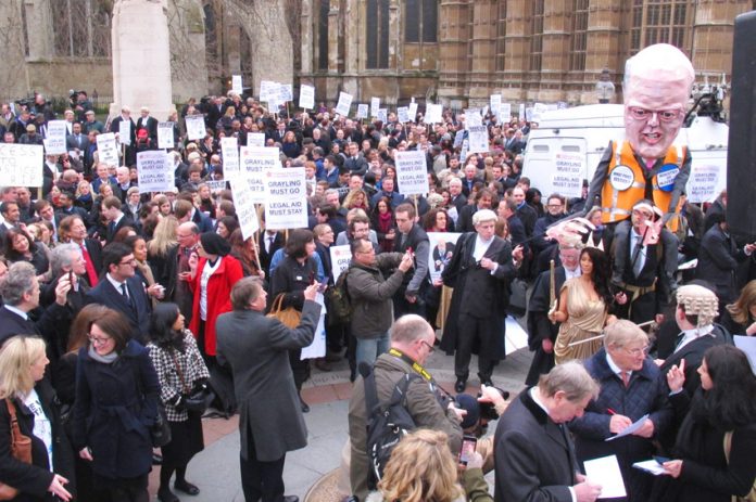 A section of the 3,000-strong rally of barristers, solicitors, probation staff and their supporters opposite parliament yesterday morning