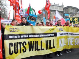 RMT and TSSA members marching against rail cuts that are putting lives at risk
