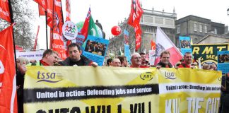 RMT and TSSA members marching against rail cuts that are putting lives at risk
