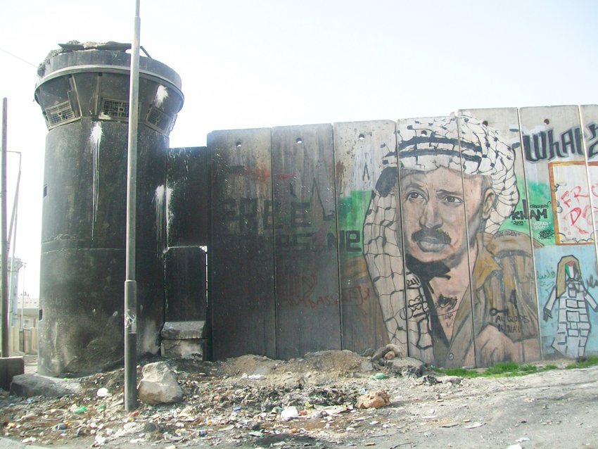 A picture of Yasser Arafat on the Israeli Separation Wall built so that Israel could annex settlements and surround Palestinian areas