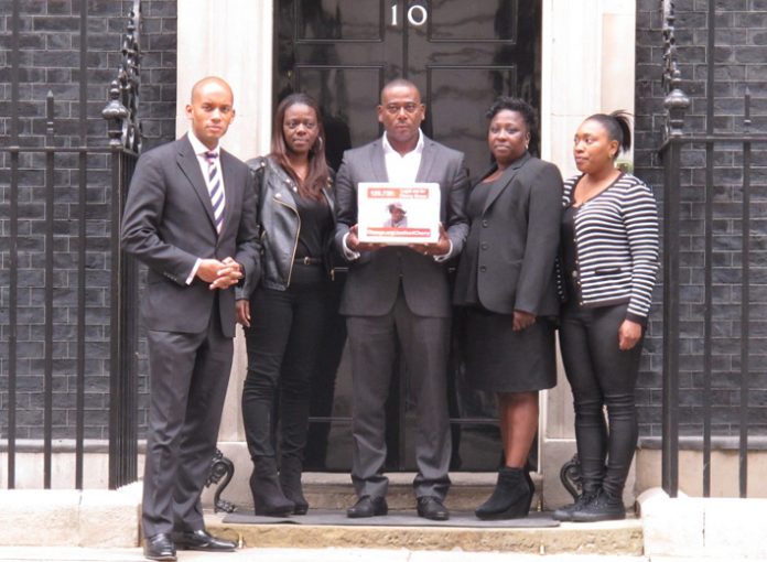 Streatham Labour MP CHUKA UMUNNA, LISA LAWRENCE, LEE LAWRENCE, ROSEMARY SPENCER and CHARMAINE LAVILLE before handing the Groce family petition into No 10