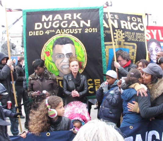 Banners of the campaigns of the Mark Duggan and Sean Rigg families on a United Families and Friends demonstration