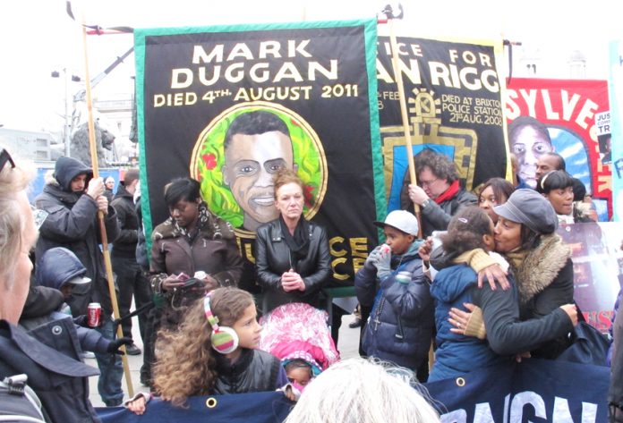 Banners of the campaigns of the Mark Duggan and Sean Rigg families on a United Families and Friends demonstration