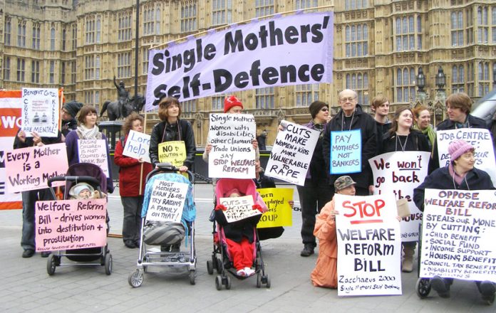 Mothers demonstrate outside the House of Commons against government benefit cuts