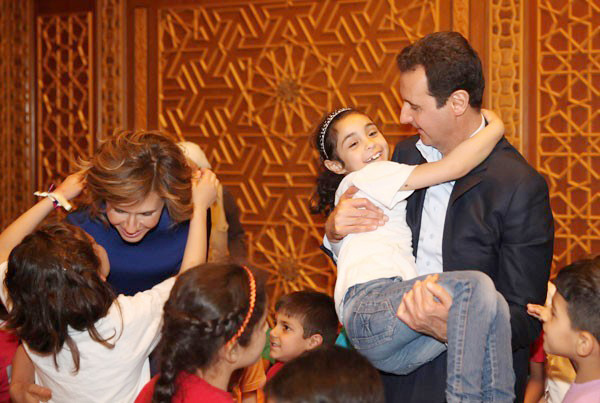 Syrian president BASHAR AL-ASSAD and his wife ASMA receiving sons and daughters of martyrs on Martyrs’ Day