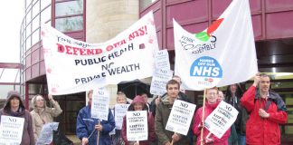 ‘KEEP THE NHS FREE’ demonstrators greet delegates to the GP conference in York – delegates voted for that policy
