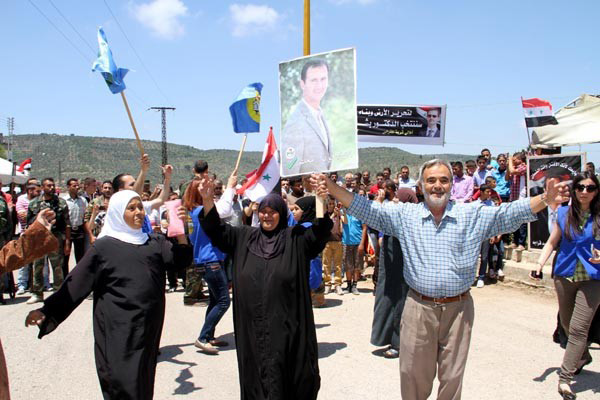 Syrians enthusiastically show their support for President Assad in Lattakia in the run-up to the election on June 4th