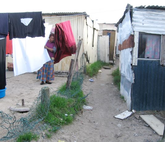 A South African woman living in the Khayelitsha township in Cape Town where there is no running water or electricity
