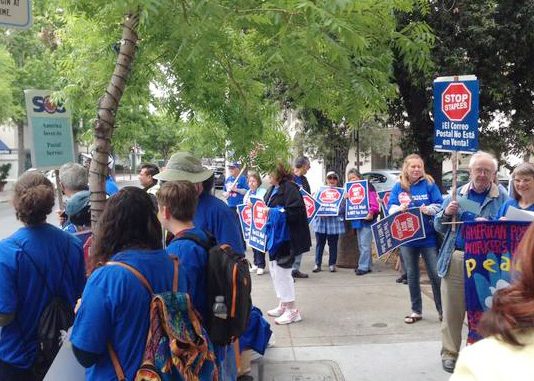 Postal workers picket of Staples to boycott the stores’ use of non-union workers providing postal services