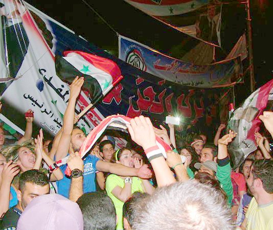 Thousands of Syrians celebrated throughout the night in Damascus after hearing that Bashar al-Assad had been elected for a new constitutional term