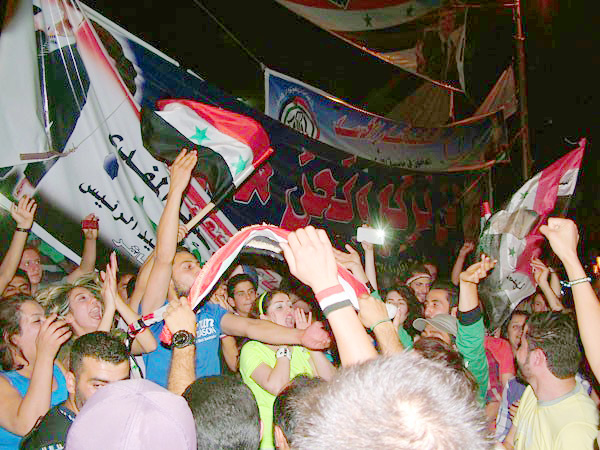Thousands of Syrians celebrated throughout the night in Damascus after hearing that Bashar al-Assad had been elected for a new constitutional term