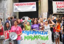 Cleaners outside the blockaded Finance Ministry building in central Athens