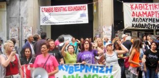 Cleaners outside the blockaded Finance Ministry building in central Athens