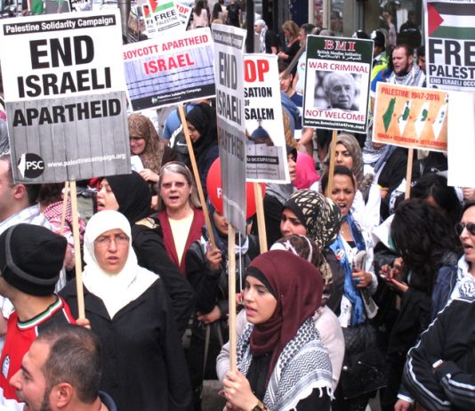 End Israeli Apartheid. Boycott Apartheid Israel were popular slogans