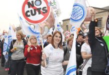 Nurses on a TUC demonstration demand no cuts to the NHS